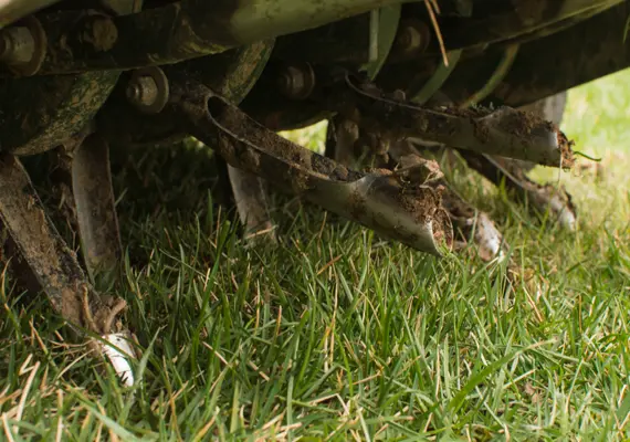 Lawn aeration service equipment working on grass in Caseyville IL