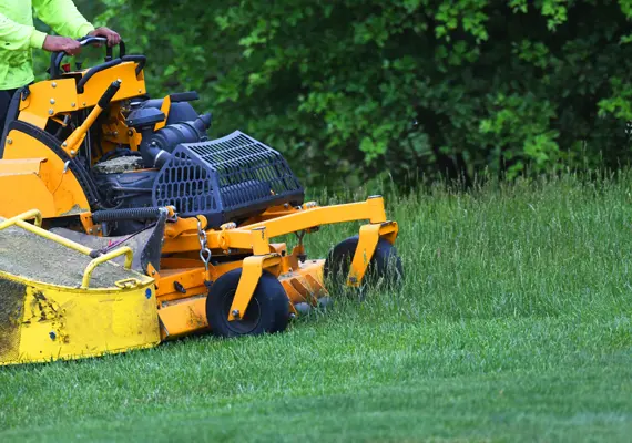 Lawn mowing service in Maryville IL cutting tall grass